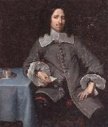 unknow artist Portrait of a gentleman,three-quarter length,standing beside a table oil painting reproduction